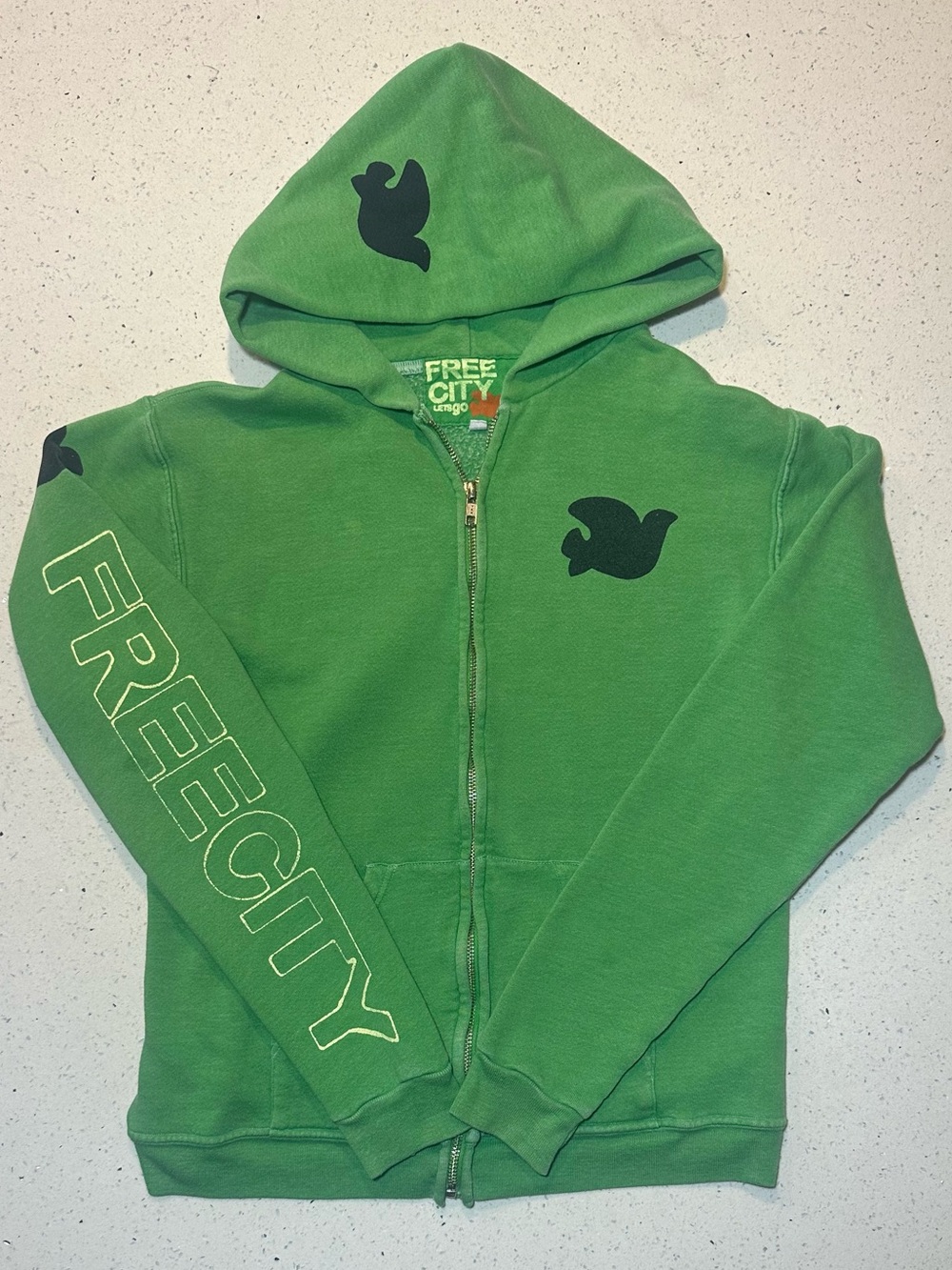 freecity / Green “Neighborhood” dove zip hoodie with sleeve detail / pre-loved